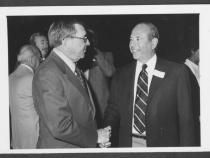 Portrait of Former Nevada Governor Grant Sawyer (left) greets Clifford Perlman (right).