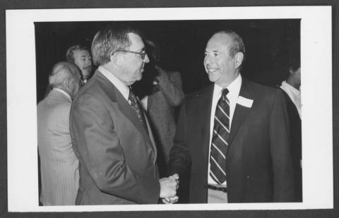 Portrait of Former Nevada Governor Grant Sawyer (left) greets Clifford Perlman (right).